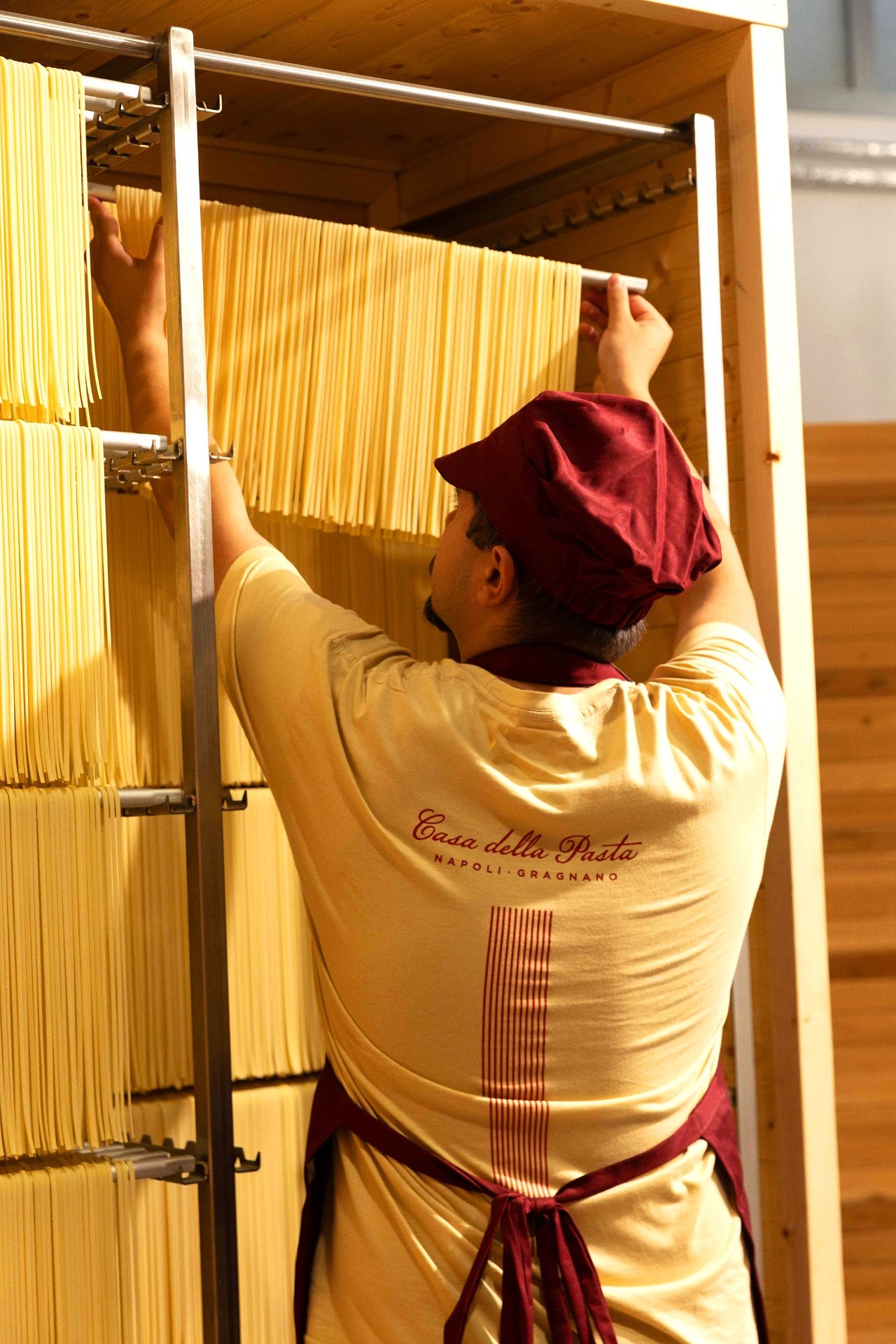 Pasta master hanging spaghetti to dry